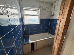 Bathroom with blue tile bathtub Watford
